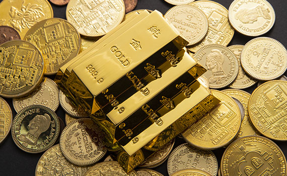 lingotes monedas oro pila